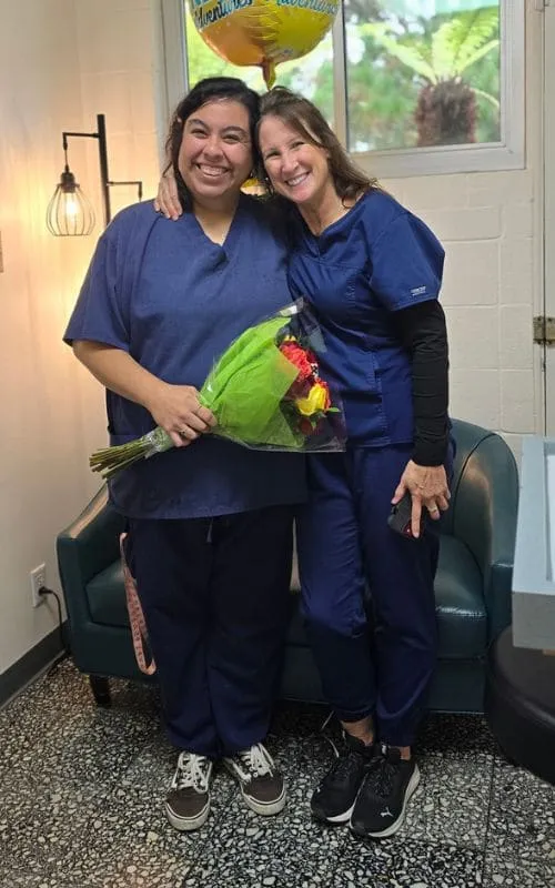 Two team members hugging on Kasandra’s last day